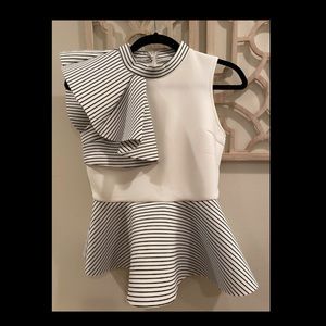 Peplum top with asymmetrical ruffle trim